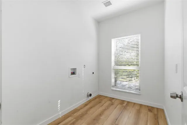 a bathroom with a toilet a sink a vanity and mirror