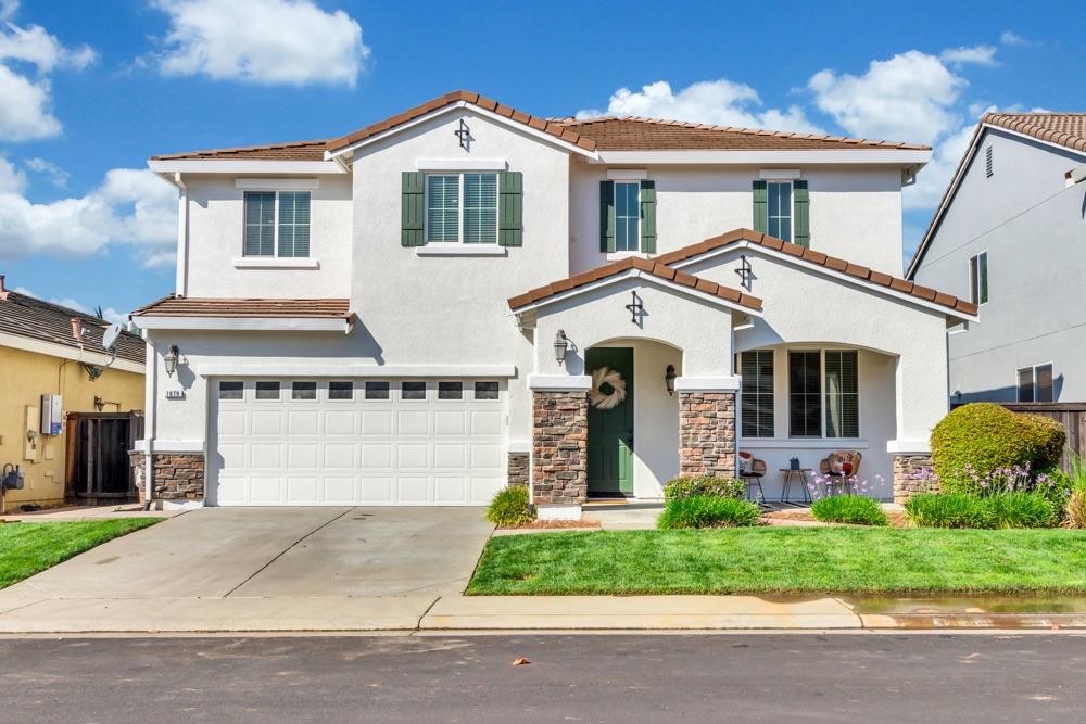 1079 Ashford Lane Lincoln, CA 95648 - Photo 1 of 1 a front view of a house with garden