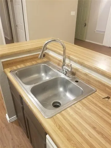 a white toilet sitting next to a bathroom sink