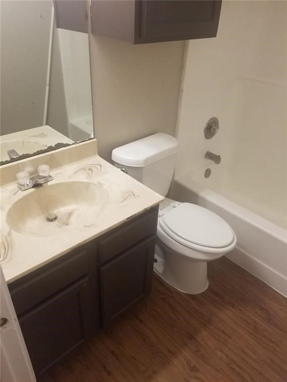 1214 Orchard Park Circle Pflugerville, TX 78660 - Photo 13 of 15 a white toilet sitting next to a bathroom sink
