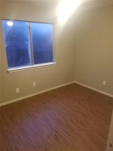 a bathroom with a toilet and a bathtub