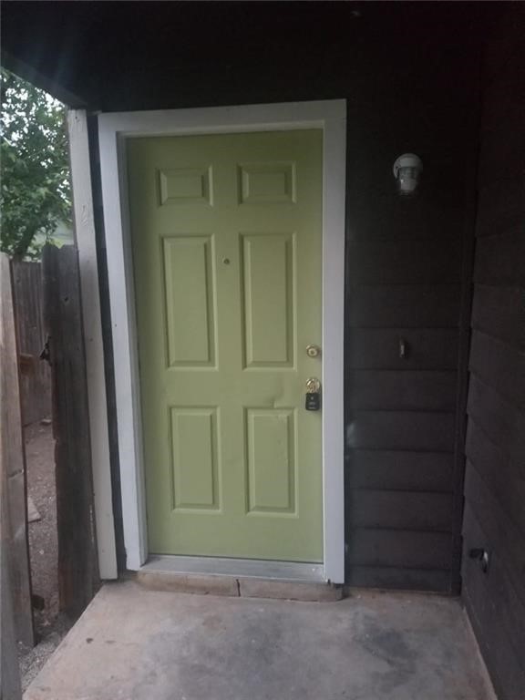 1214 Orchard Park Circle Pflugerville, TX 78660 - Photo 2 of 15 an empty room with a door