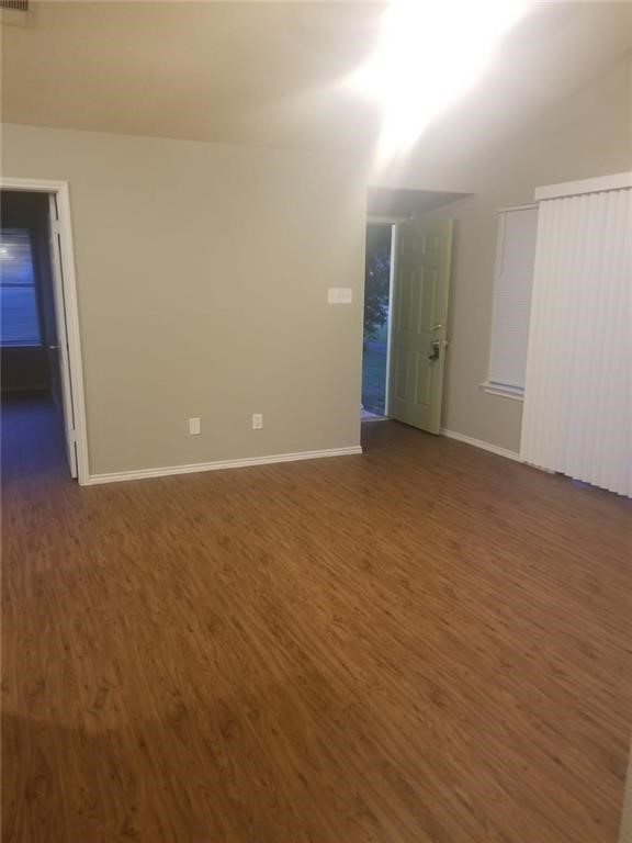 1214 Orchard Park Circle Pflugerville, TX 78660 - Photo 3 of 15 a view of an empty room with wooden floor and closet