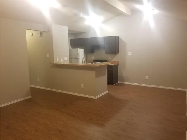 a view of a kitchen with a sink