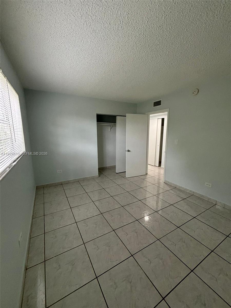 8101 Southwest 73rd Avenue, Unit 28 Miami, FL 33143 - Photo 13 of 21 a view of an empty room and window