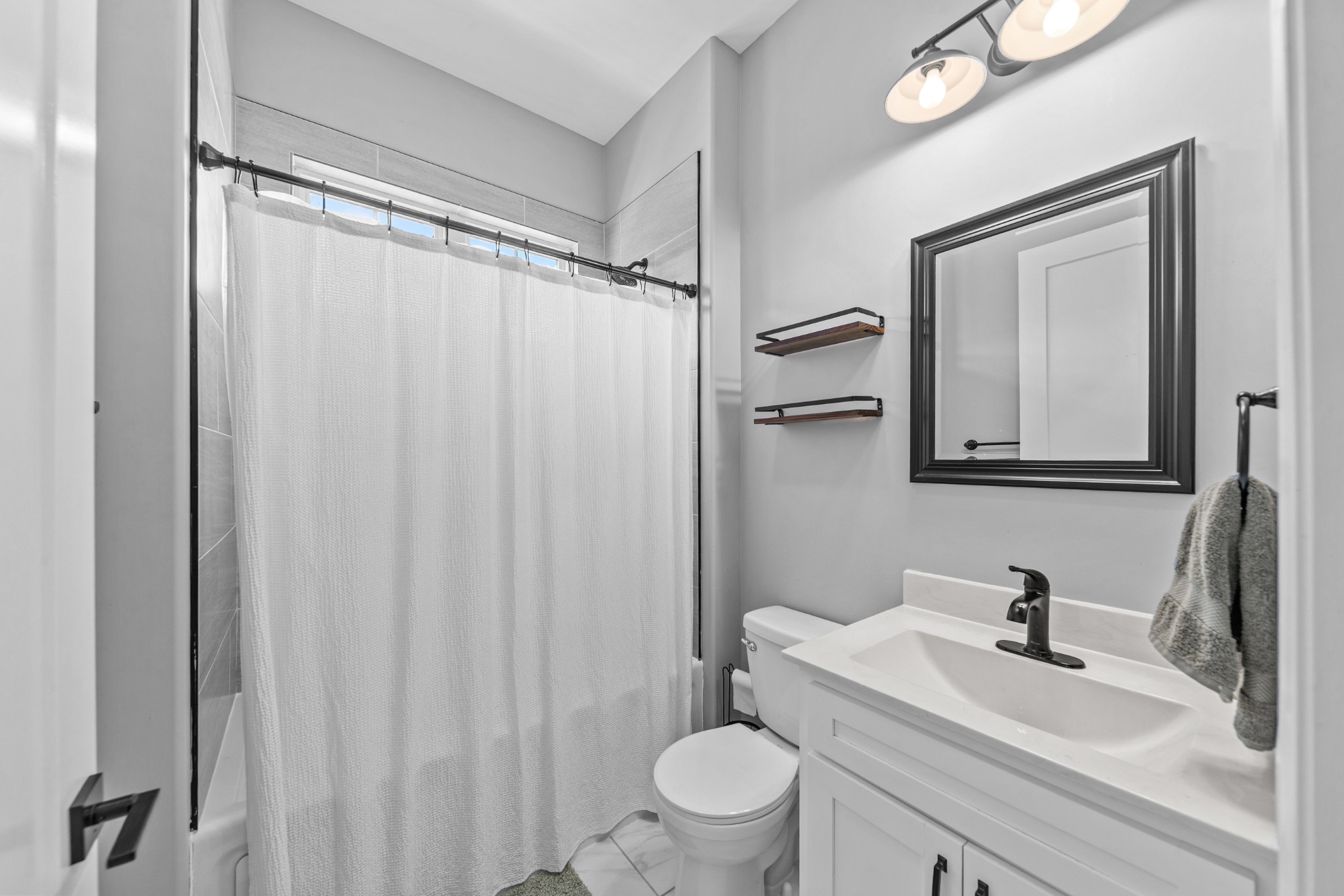 4770 Delina Road Cornersville, TN 37047 - Photo 11 of 71 a white toilet sitting next to a bathroom sink