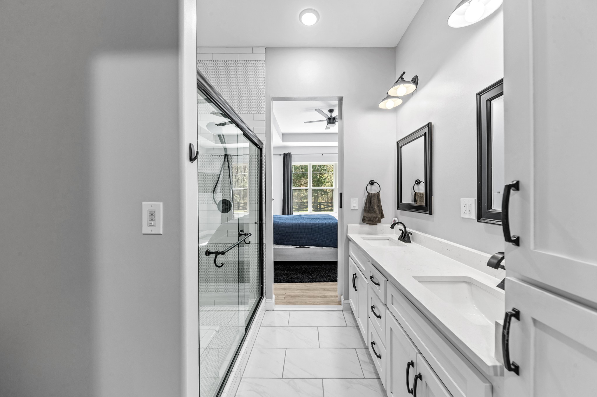 4770 Delina Road Cornersville, TN 37047 - Photo 18 of 71 a spacious en suite bathroom with a double vanity sink a large mirror and a shower
