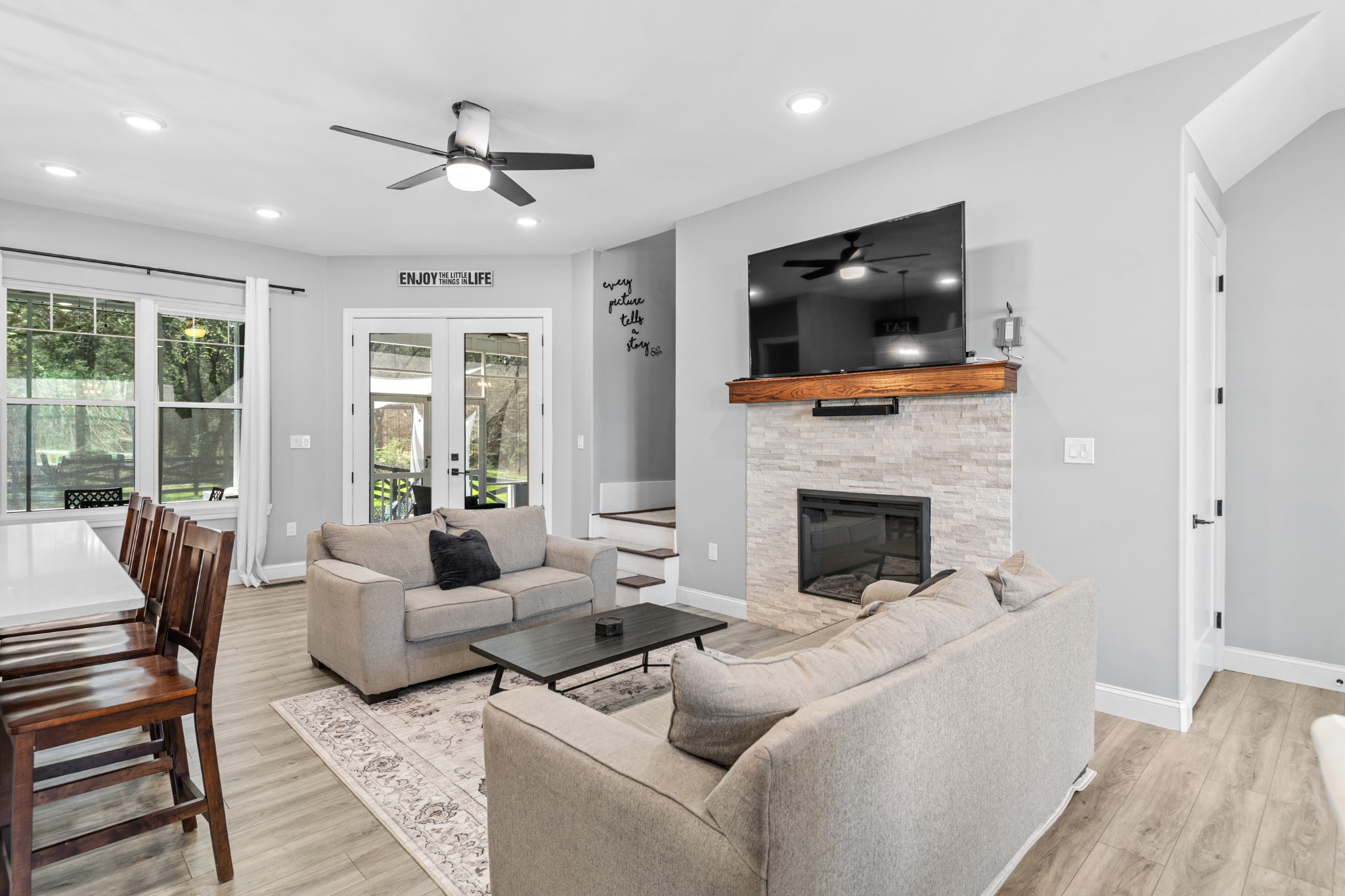 4770 Delina Road Cornersville, TN 37047 - Photo 34 of 71 a living room with furniture a flat screen tv and a fireplace