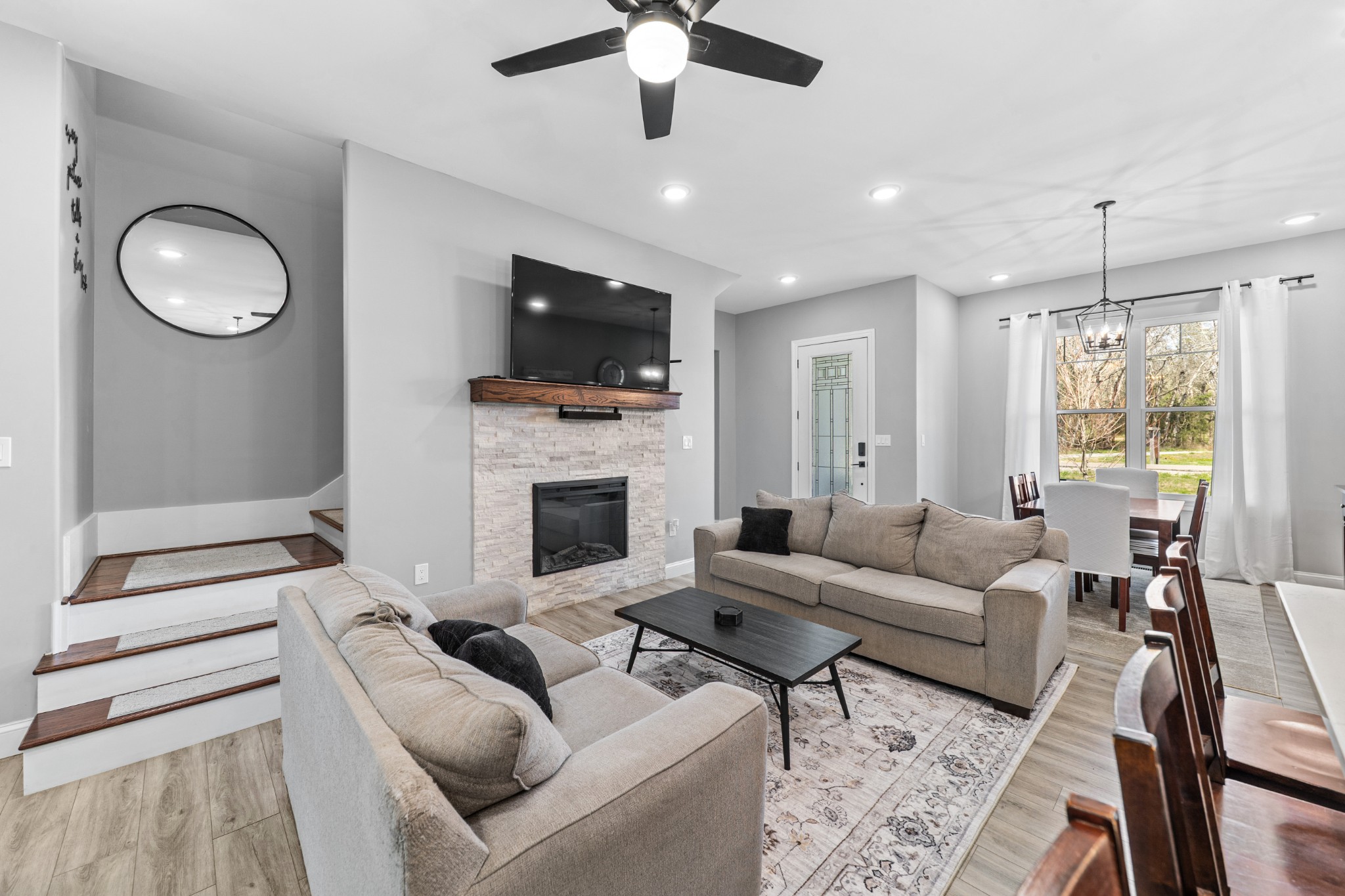 4770 Delina Road Cornersville, TN 37047 - Photo 36 of 71 a living room with furniture a fireplace and a flat screen tv