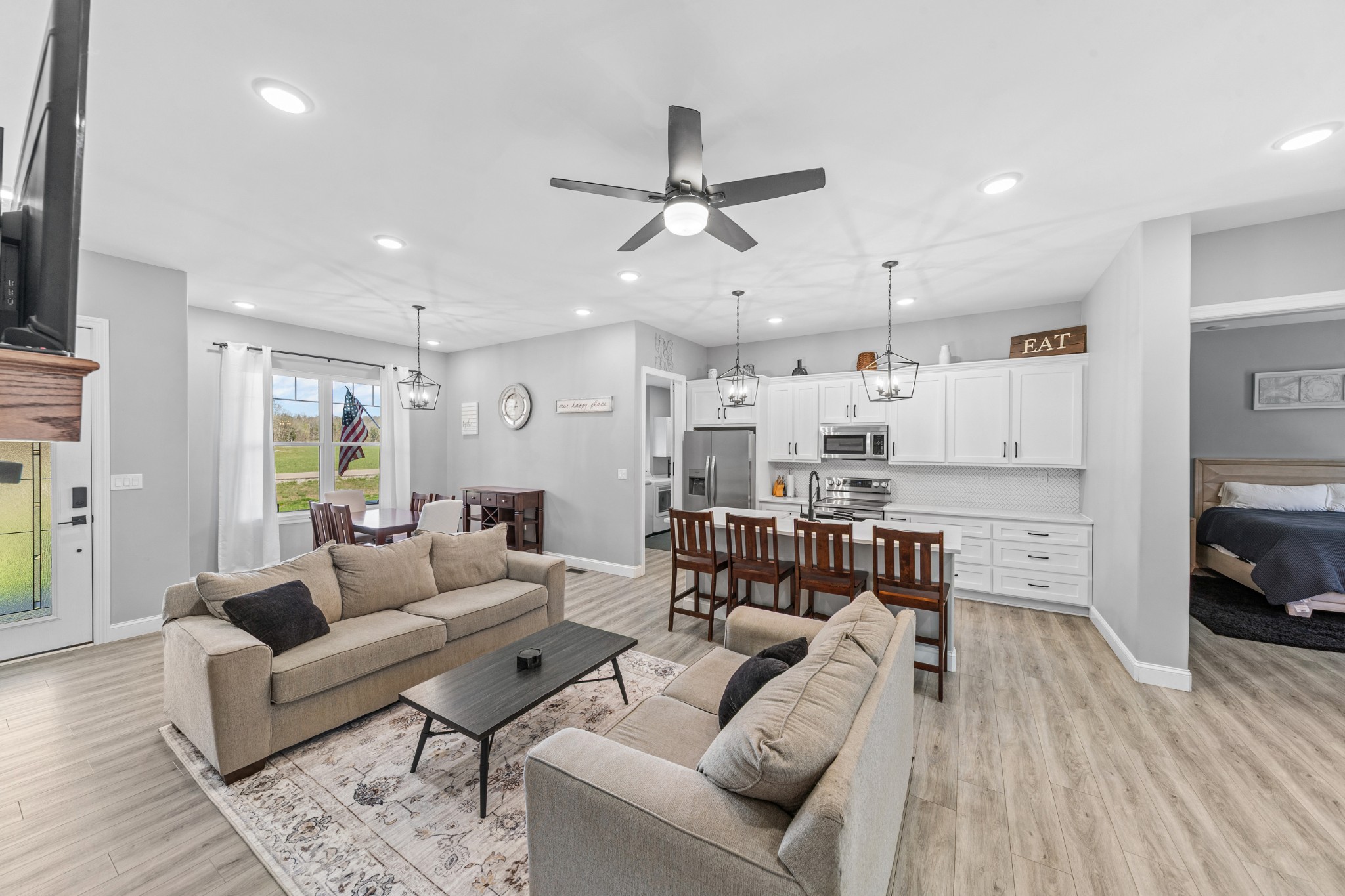 4770 Delina Road Cornersville, TN 37047 - Photo 37 of 71 a living room with furniture kitchen view and a wooden floor