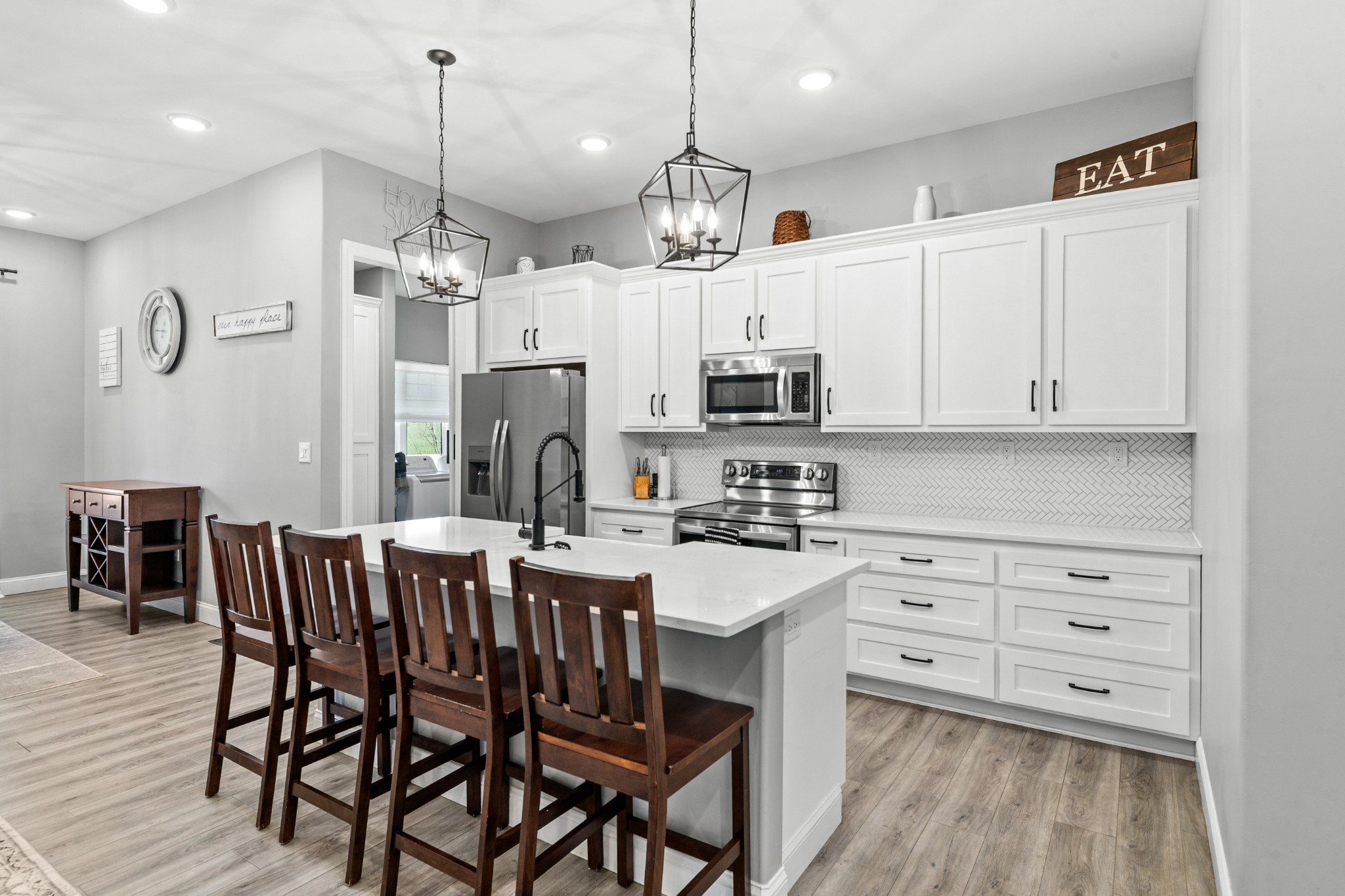 4770 Delina Road Cornersville, TN 37047 - Photo 39 of 71 a kitchen with stainless steel appliances kitchen island granite countertop a table chairs and a refrigerator