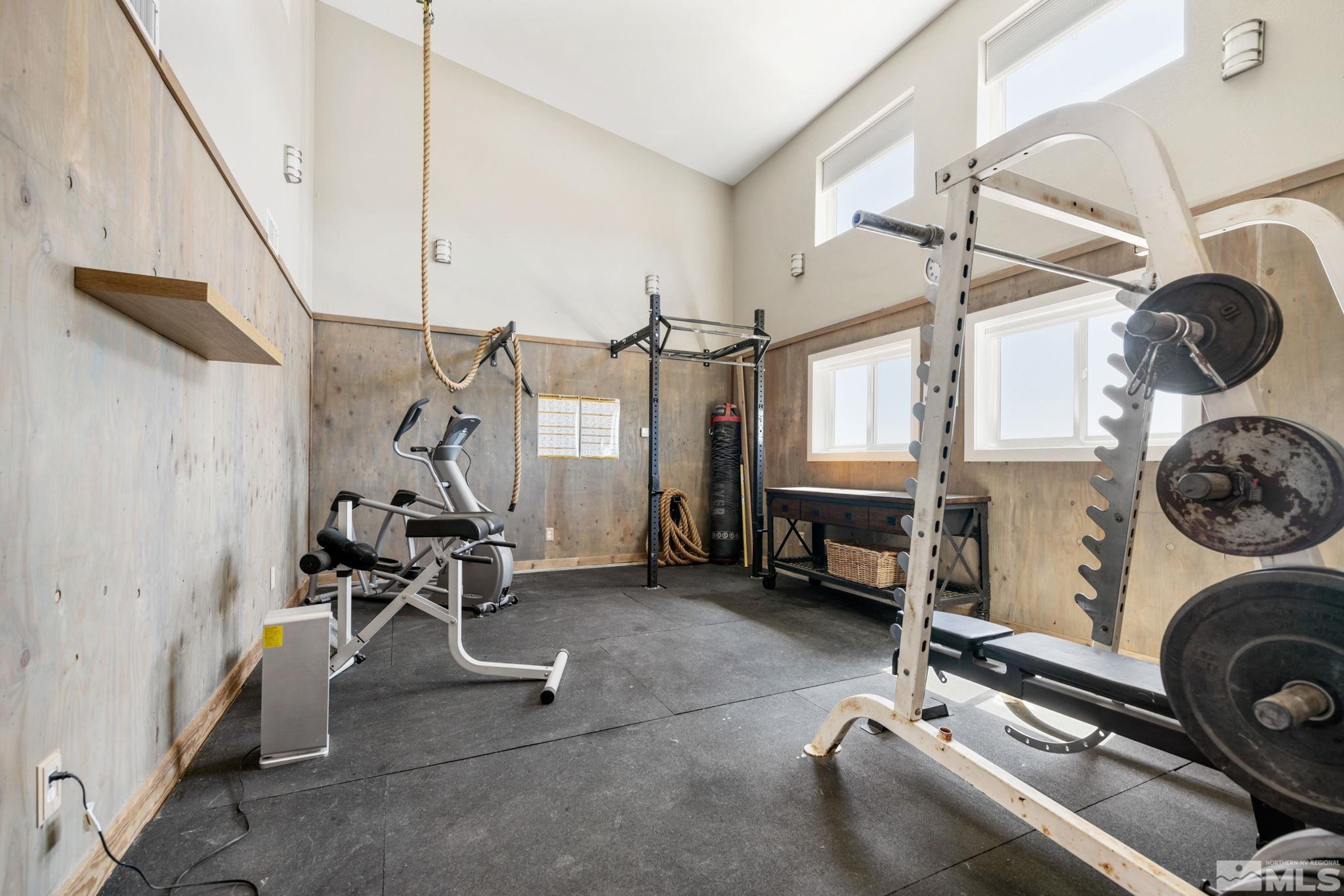 205 Eagle Vw Trail Dayton, NV 89403 - Photo 19 of 40 a room with gym equipment and a large window