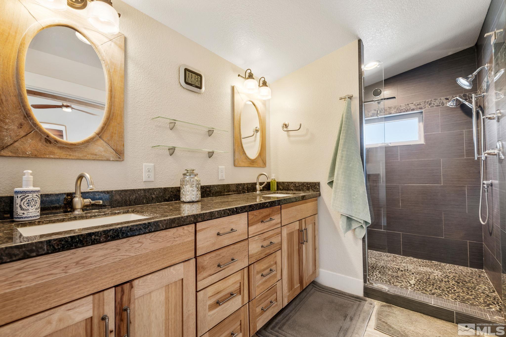 205 Eagle Vw Trail Dayton, NV 89403 - Photo 24 of 40 a bathroom with a granite countertop sink mirror and double