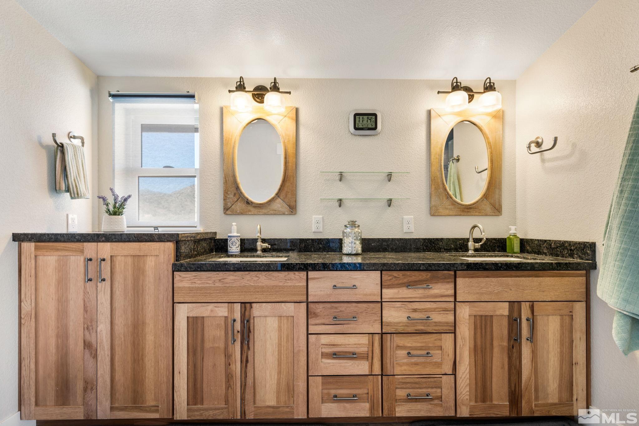 205 Eagle Vw Trail Dayton, NV 89403 - Photo 25 of 40 a bathroom with a granite countertop double vanity sink and a mirror