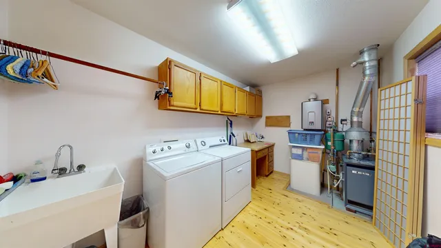 a view of a kitchen with fridge and sink