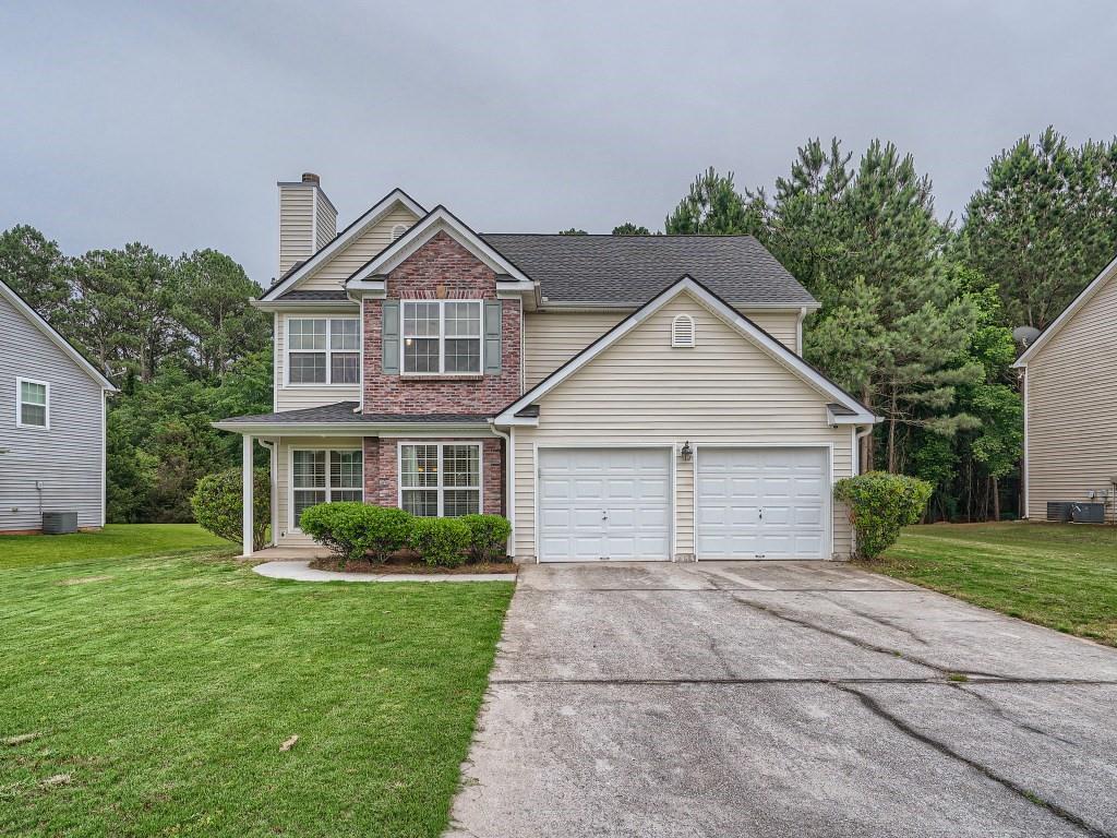 35 Stone Commons Way Covington, GA 30016 - Photo 1 of 1 a front view of house with yard and green space