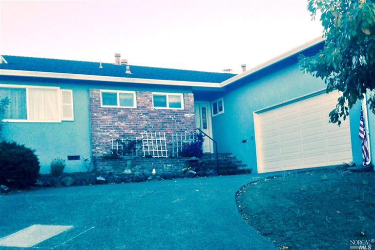 49 Ridgewood Drive San Rafael, CA 94901 - Photo 1 of 1 a front view of a house with garden