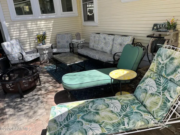 a view of a chairs and table in the patio