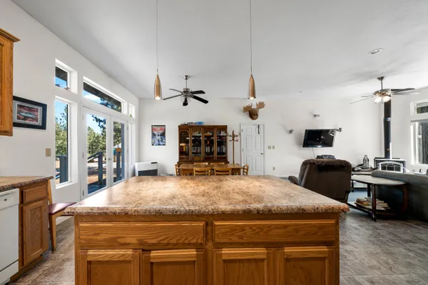 a kitchen that has a stove and a table