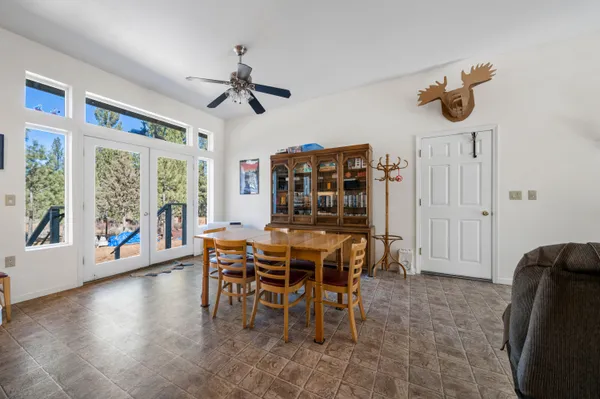 a dining room with furniture and window
