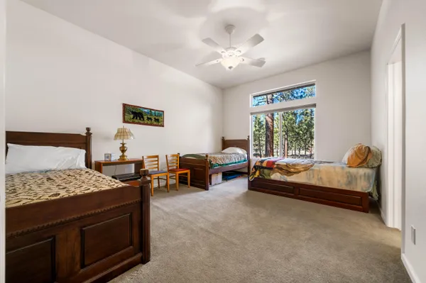 a bedroom with furniture and a chandelier