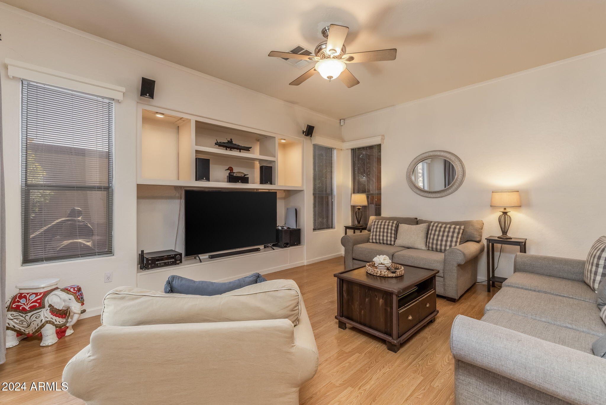 3355 East Los Altos Road Gilbert, AZ 85297 - Photo 15 of 34 a living room with furniture flat screen tv and a ceiling fan