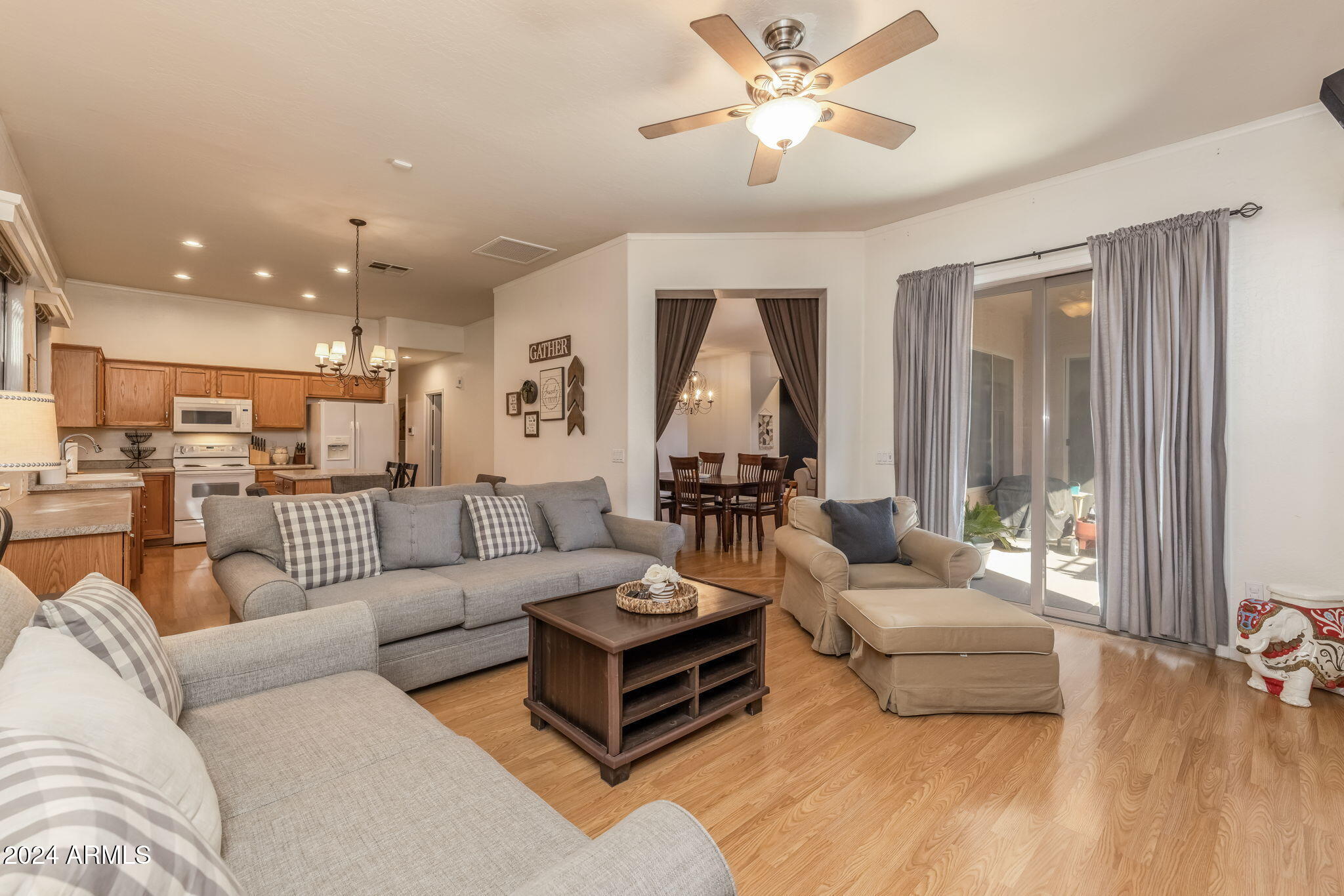 3355 East Los Altos Road Gilbert, AZ 85297 - Photo 16 of 34 a living room with furniture and a large window