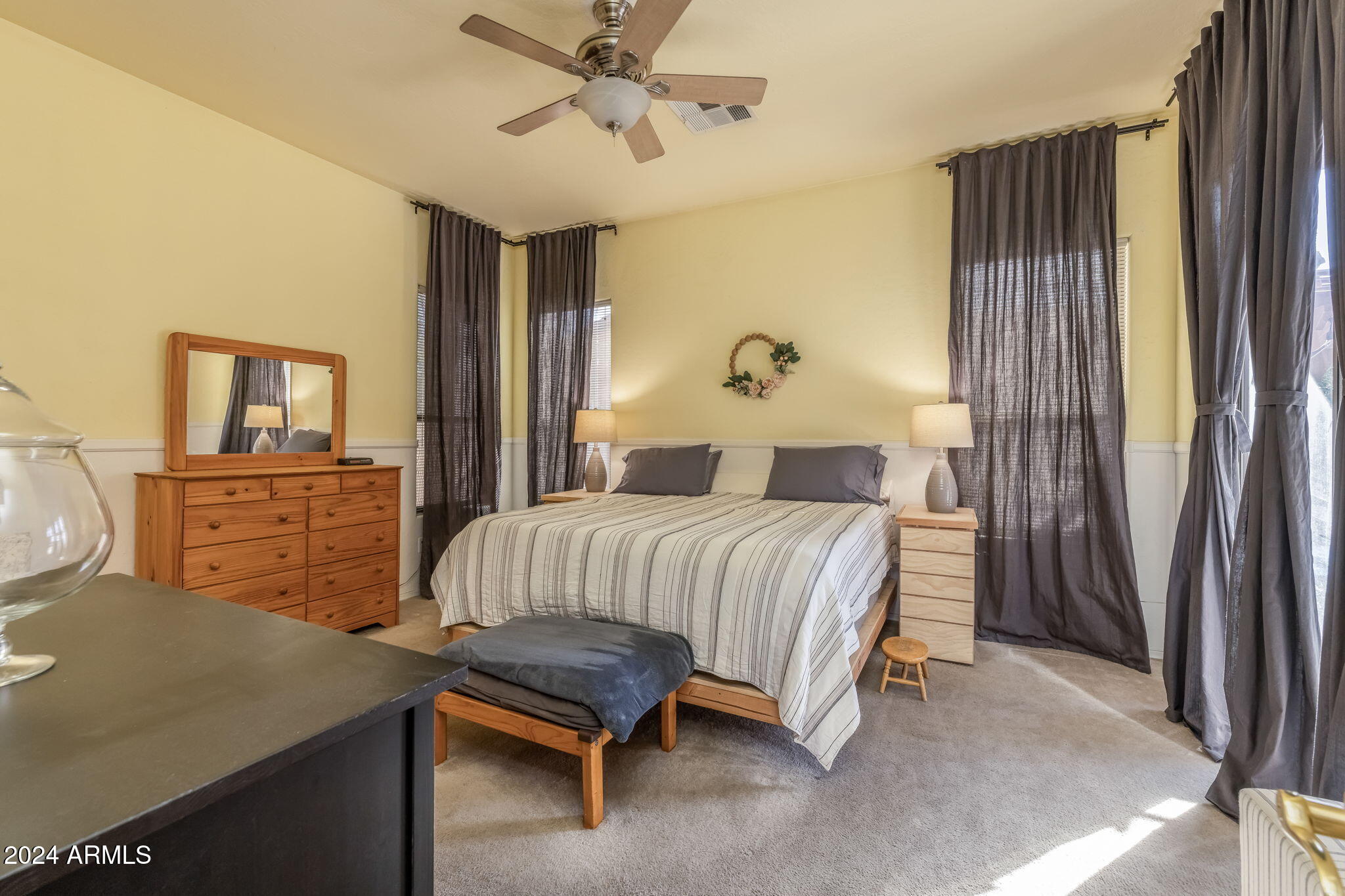 3355 East Los Altos Road Gilbert, AZ 85297 - Photo 17 of 34 a bedroom with a bed and a dresser