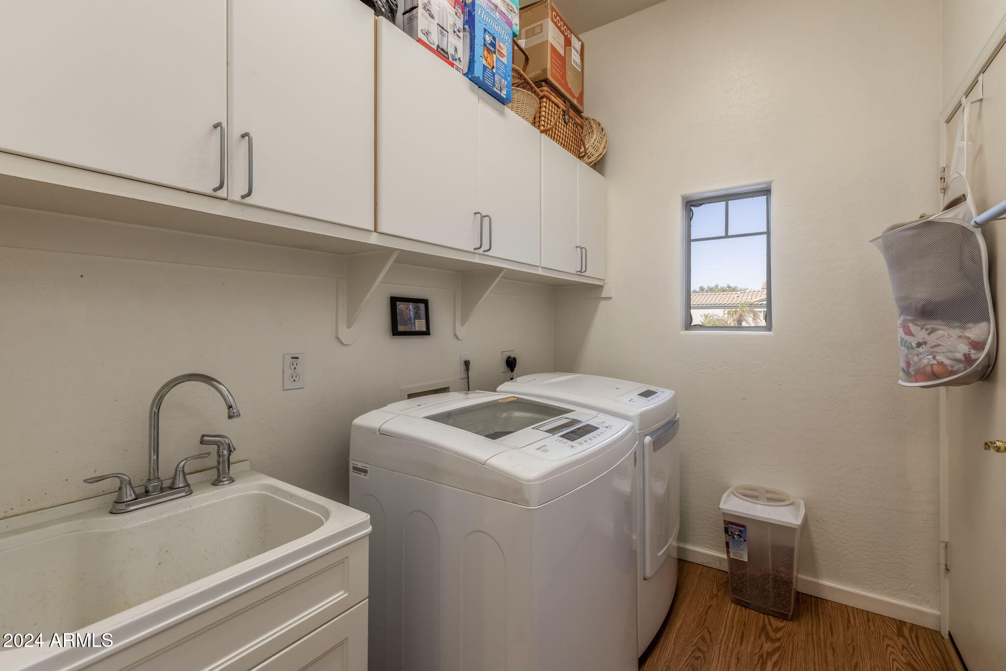 3355 East Los Altos Road Gilbert, AZ 85297 - Photo 26 of 34 a utility room with sink dryer and washer