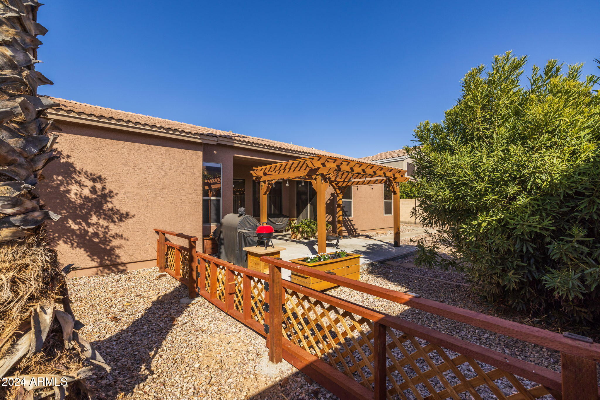 3355 East Los Altos Road Gilbert, AZ 85297 - Photo 27 of 34 a view of balcony with wooden floor and outdoor seating