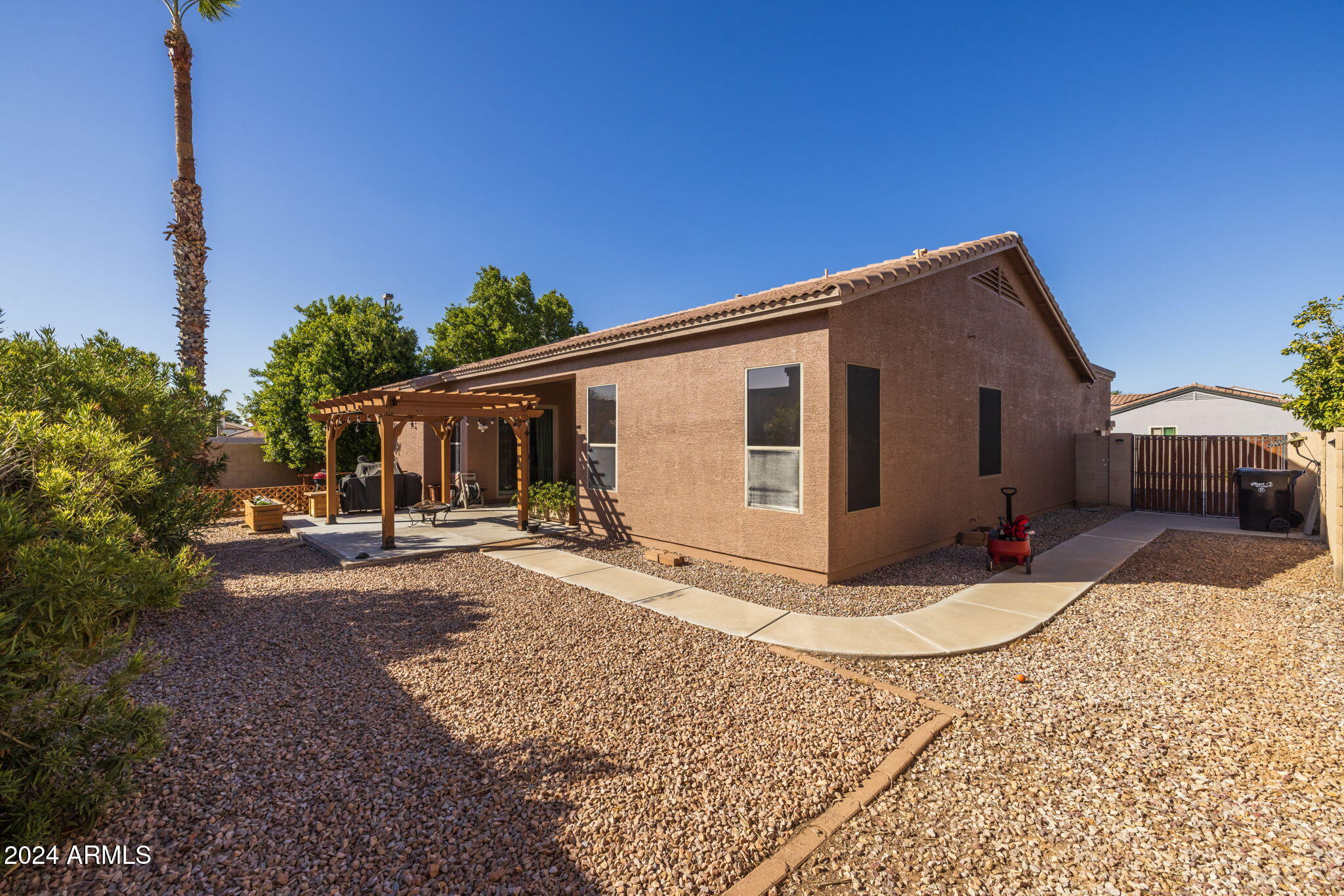 3355 East Los Altos Road Gilbert, AZ 85297 - Photo 28 of 34 a view of a house with backyard