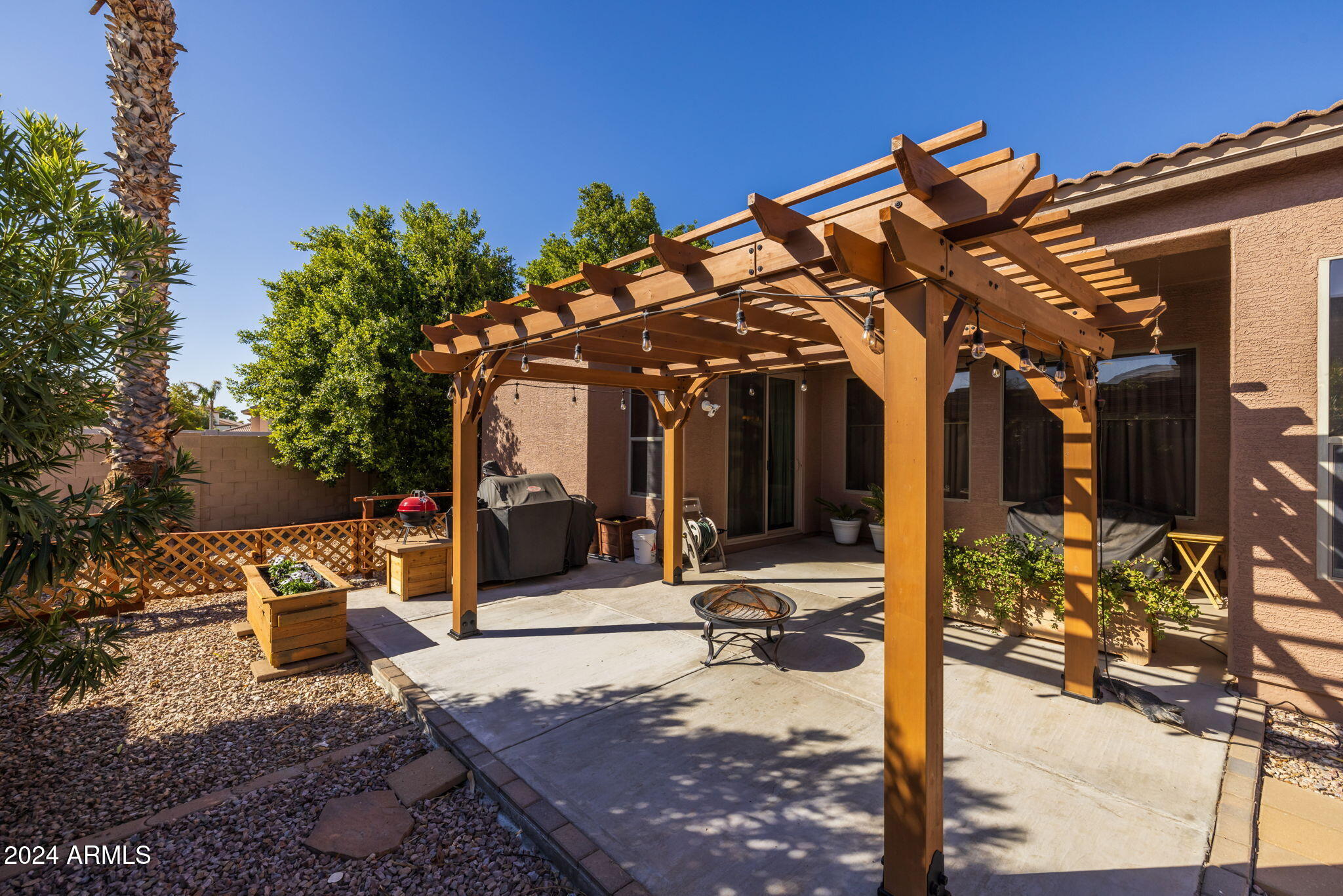 3355 East Los Altos Road Gilbert, AZ 85297 - Photo 31 of 34 a view of a chairs and tables in patio