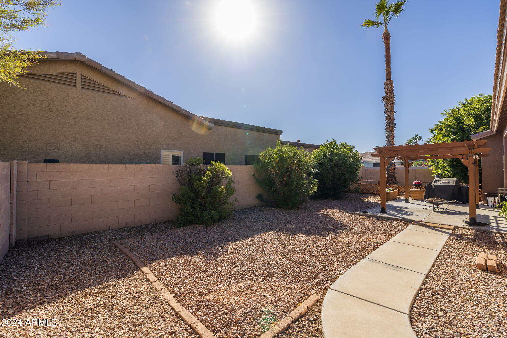 3355 East Los Altos Road Gilbert, AZ 85297 - Photo 33 of 34 a view of a street with seating space