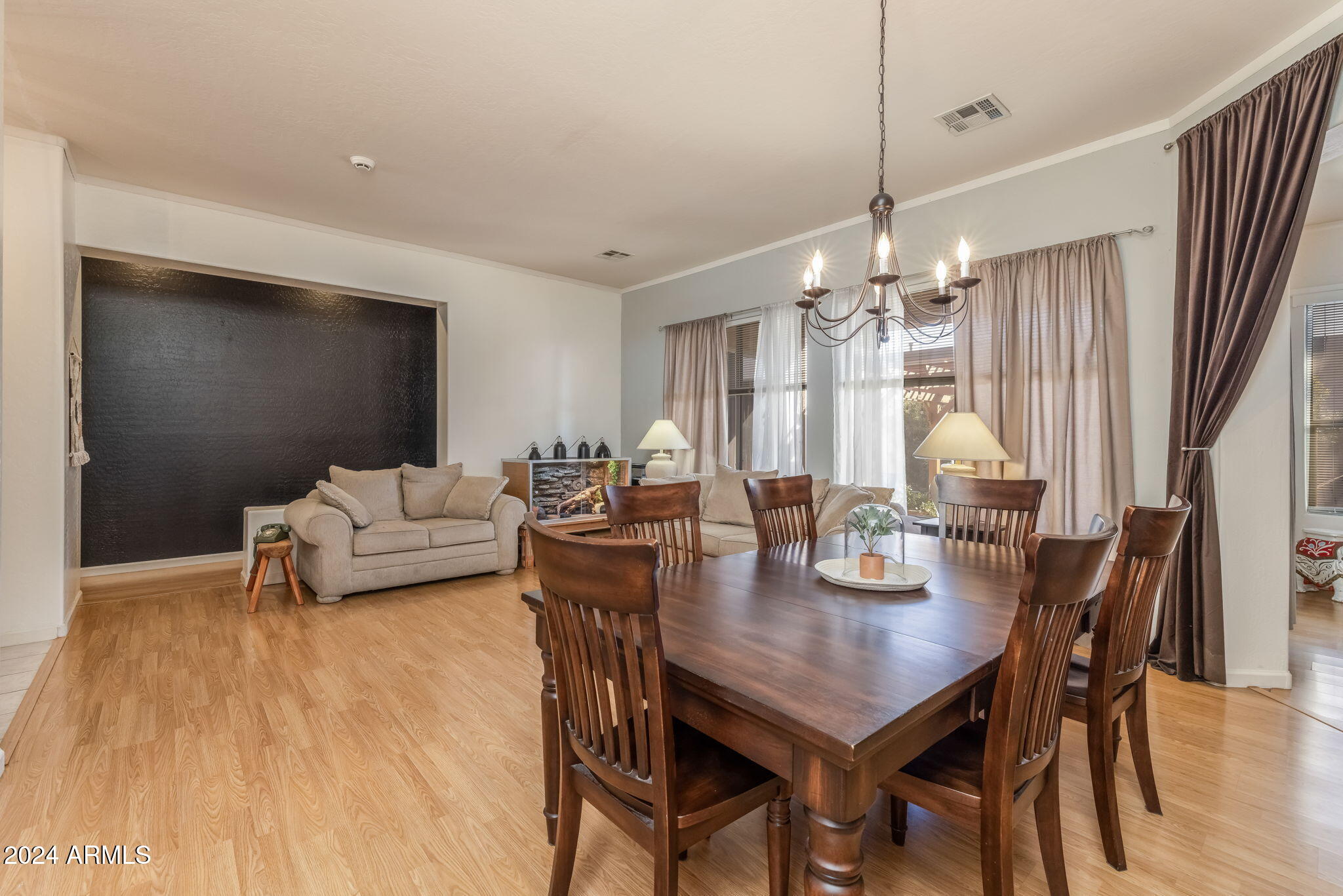 3355 East Los Altos Road Gilbert, AZ 85297 - Photo 7 of 34 a view of a dining room with furniture and wooden floor