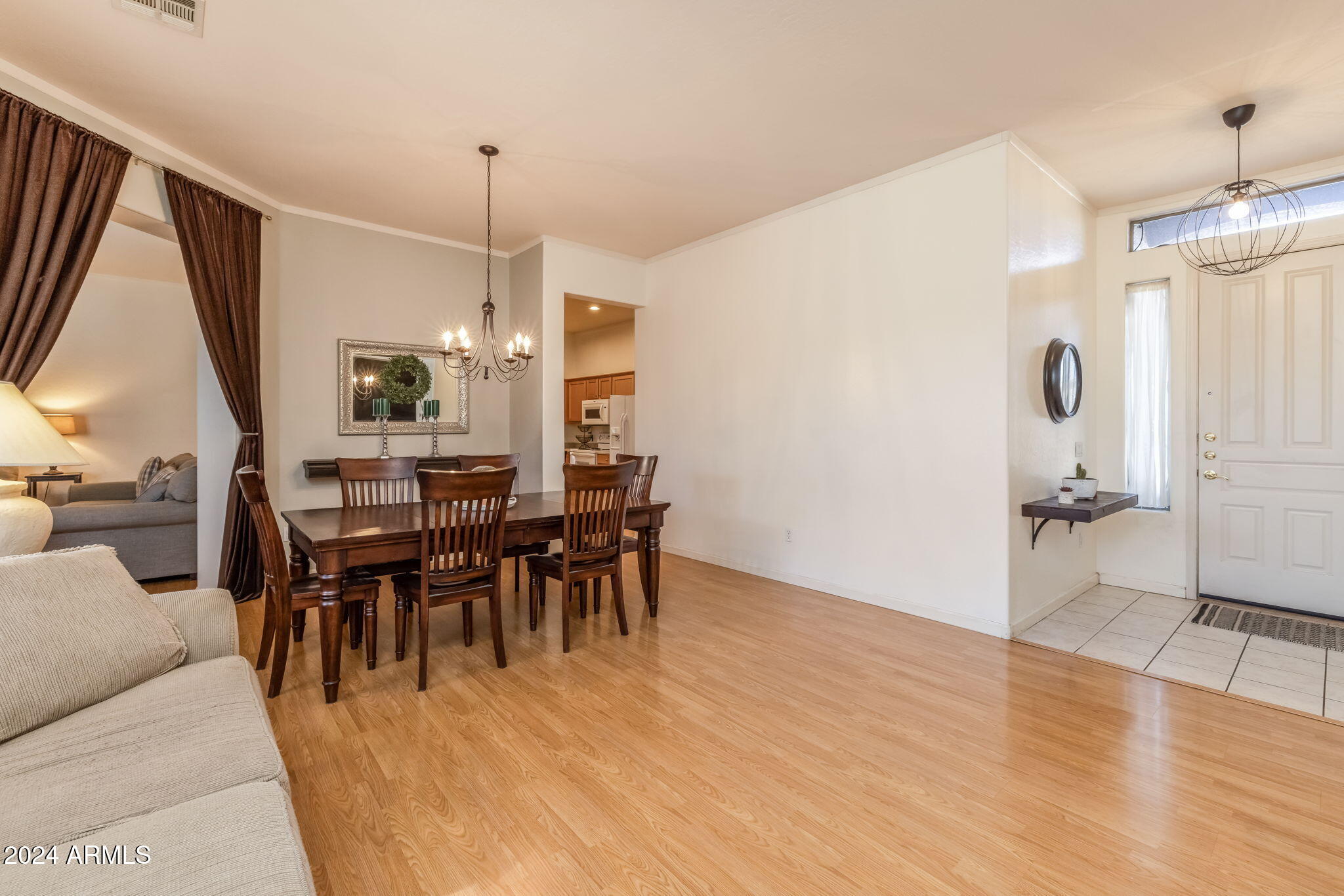 3355 East Los Altos Road Gilbert, AZ 85297 - Photo 8 of 34 a view of a dining room with furniture window and wooden floor