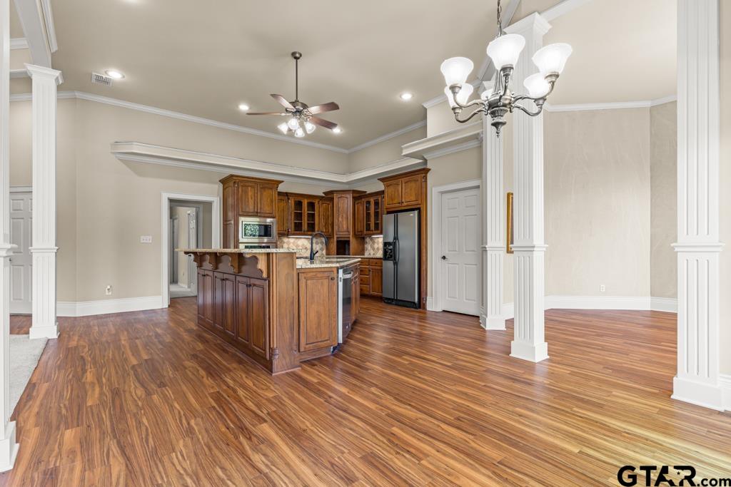 100 Lantana Road Gilmer, TX 75644 - Photo 11 of 30 a view of a room with wooden floor and kitchen view