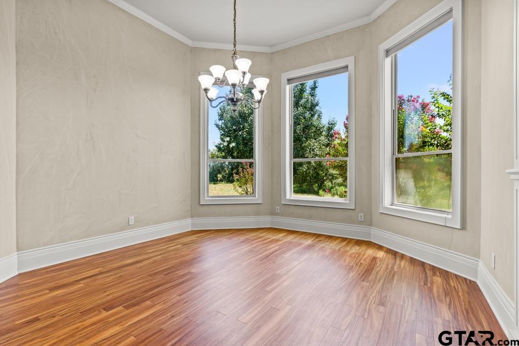 100 Lantana Road Gilmer, TX 75644 - Photo 13 of 30 wooden floor in an empty room with a window