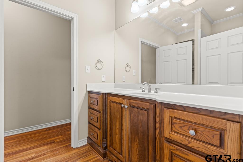 100 Lantana Road Gilmer, TX 75644 - Photo 18 of 30 a bathroom with a sink a mirror and a shower