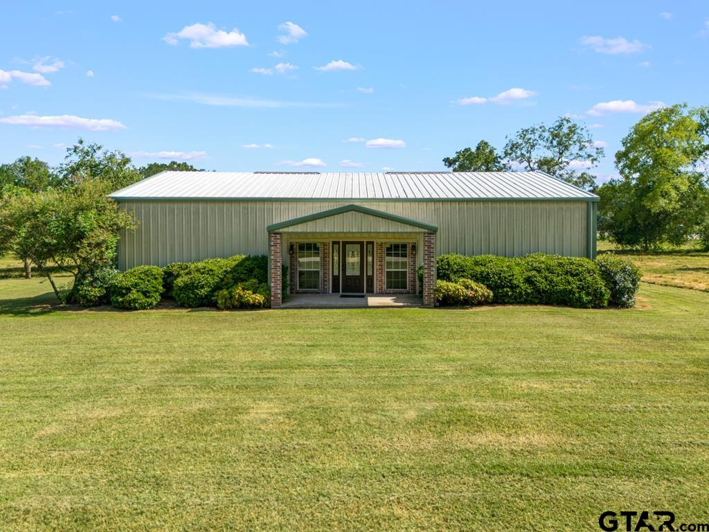 100 Lantana Road Gilmer, TX 75644 - Photo 2 of 30 a front view of a house with a garden