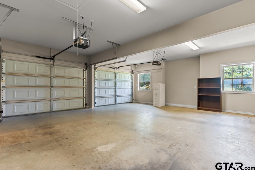100 Lantana Road Gilmer, TX 75644 - Photo 23 of 30 an empty room with a empty space and windows