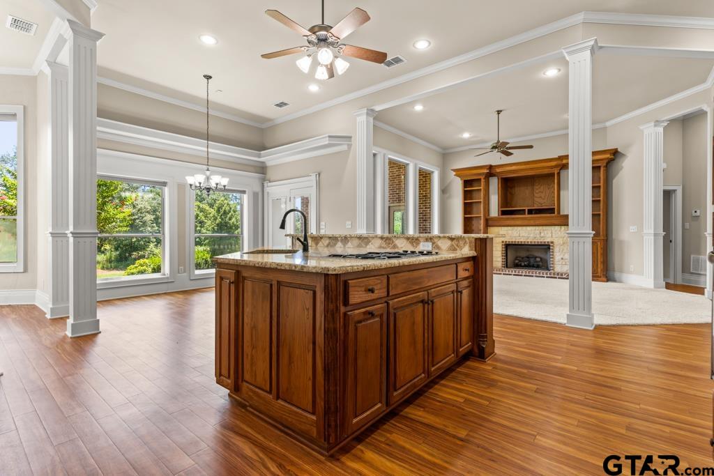 100 Lantana Road Gilmer, TX 75644 - Photo 8 of 30 a kitchen with stainless steel appliances granite countertop a stove and a wooden floors