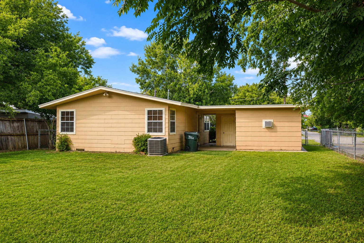 1508 Walnut Street Georgetown, TX 78626 - Photo 27 of 37 A well-maintained lawn extends to the rear of this inviting single-story residence, framed by mature trees.