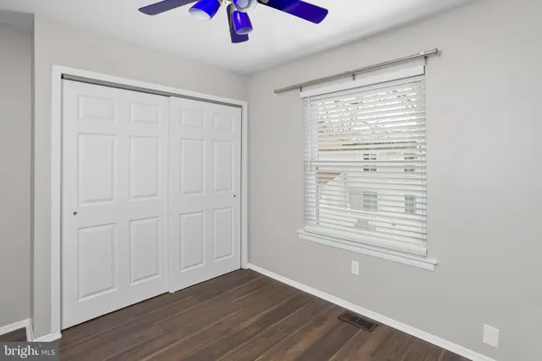 a bathroom with a sink a toilet and shower curtain