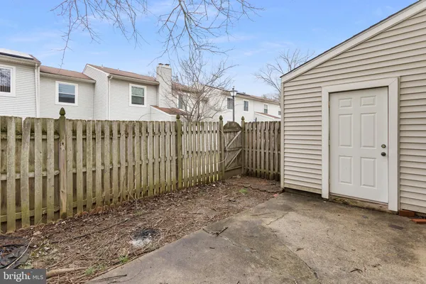 an aerial view of residential houses with outdoor space and swimming pool