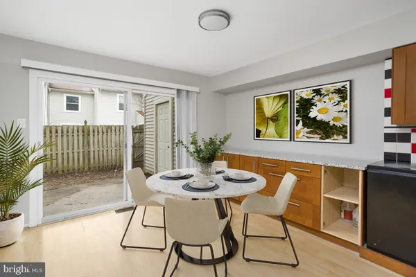 a view of a room with wooden floor and cabinet