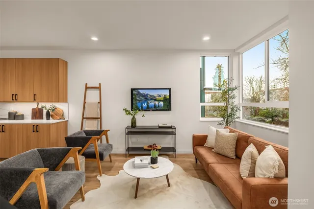 a living room with furniture and a large window