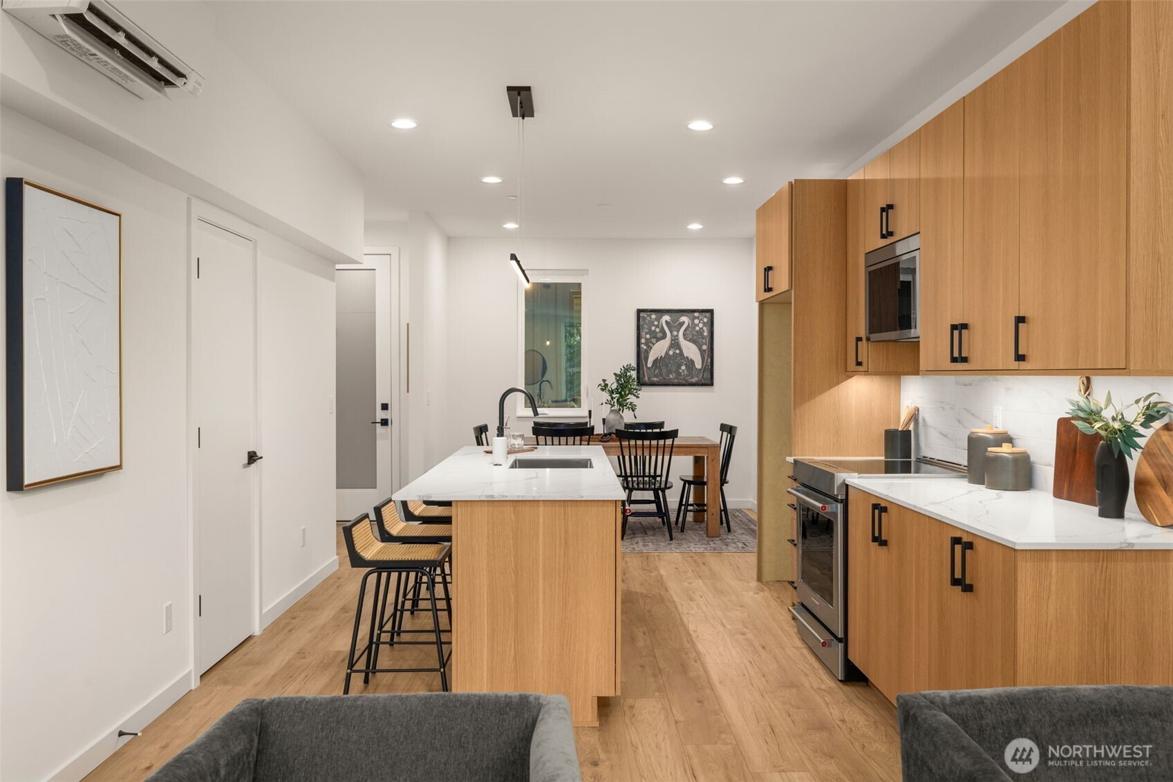 914 A 15th Avenue Seattle, WA 98122 - Photo 14 of 35 a living room with stainless steel appliances kitchen island granite countertop furniture a sink a rug and a window
