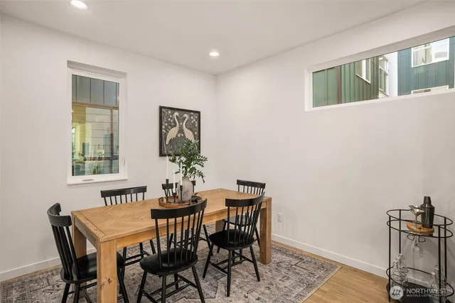 a view of a dining room with furniture and window