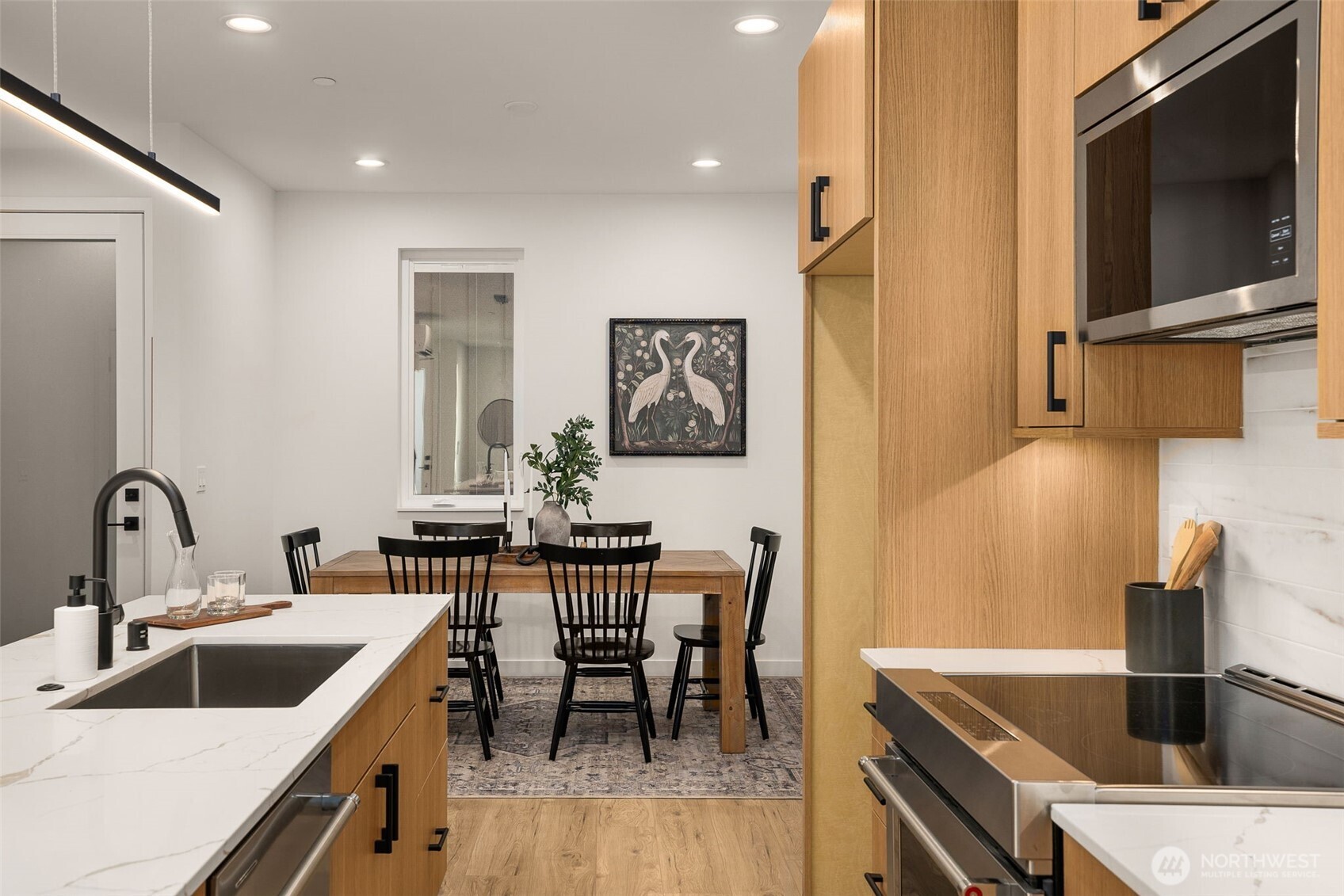 914 A 15th Avenue Seattle, WA 98122 - Photo 16 of 35 a kitchen with a dining table and chairs