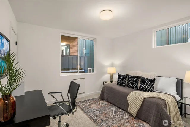 a bedroom with a bed and window